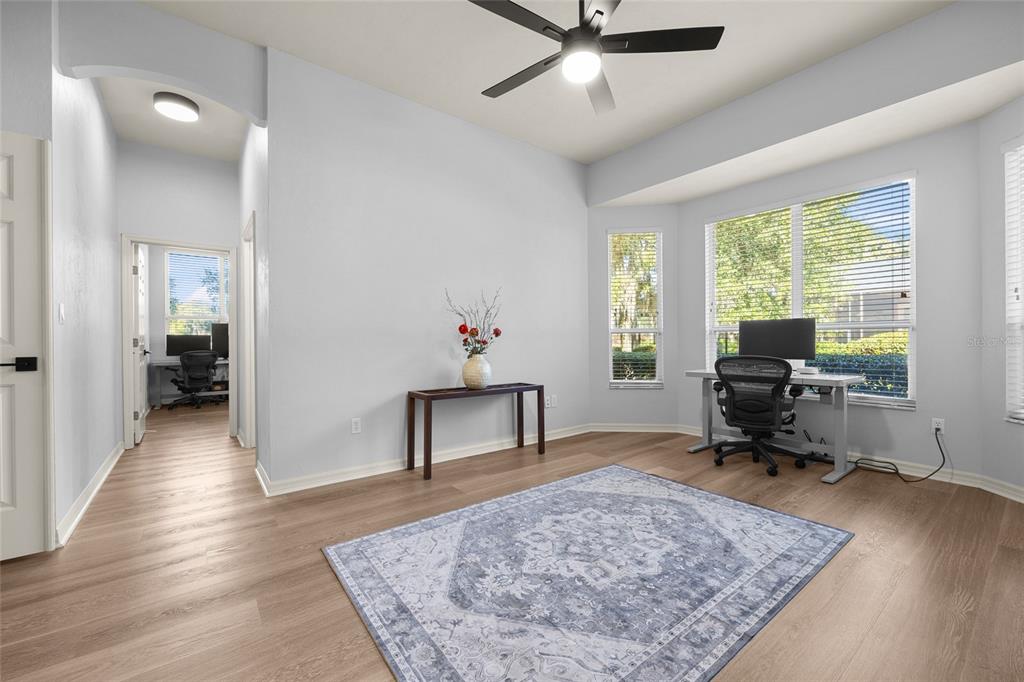 4606 Southwest 97th Terrace Gainesville, FL 32608 - Photo 39 of 68 a living room with furniture and a wooden floor