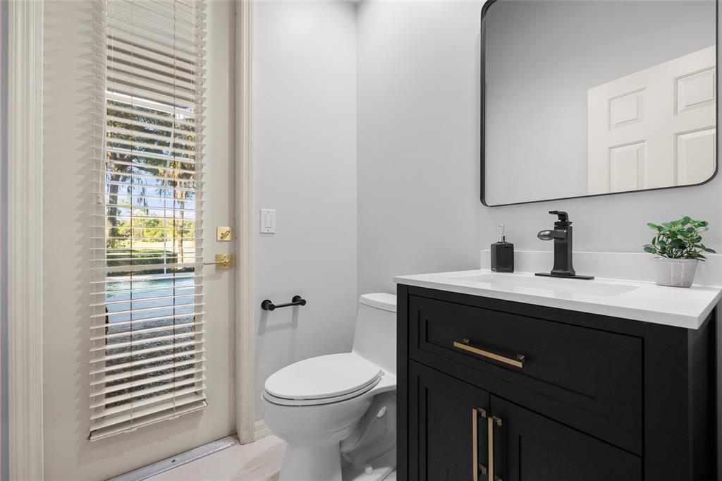 4606 Southwest 97th Terrace Gainesville, FL 32608 - Photo 47 of 68 a bathroom with a sink a toilet and mirror