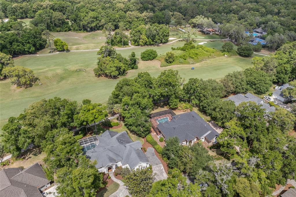 4606 Southwest 97th Terrace Gainesville, FL 32608 - Photo 62 of 68 an aerial view of residential houses with outdoor space and trees all around