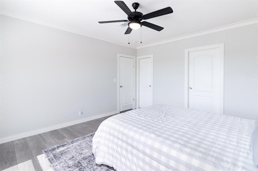 1895 County Road 472 Rochelle, TX 76872 - Photo 17 of 39 a bedroom with a bed and a ceiling fan