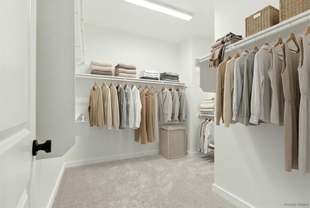2020 Aldrich Road Celina, TX 75009 - Photo 29 of 40 a view of walk in closet with clothes and shoes