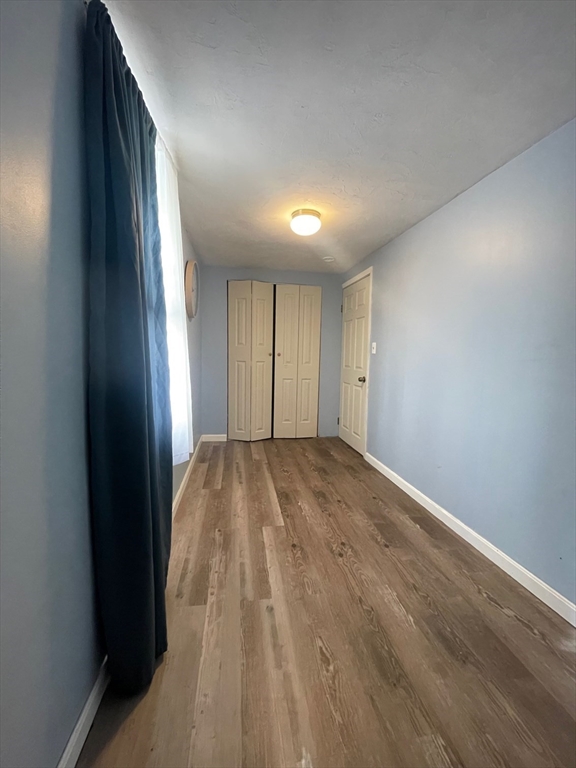 904 Main, Unit A Winchester, MA 01890 - Photo 5 of 6 an empty room with windows