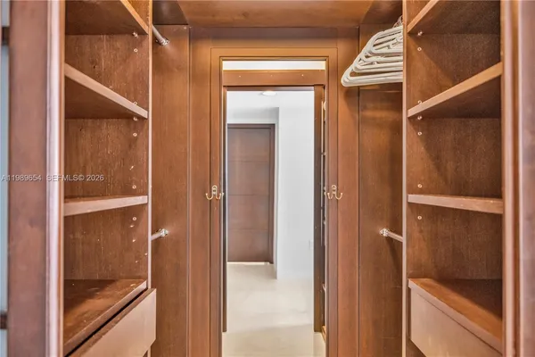 a living room with fireplace furniture and a large window