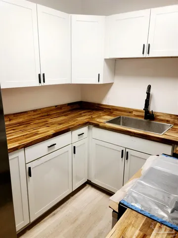 a kitchen with a sink and cabinets