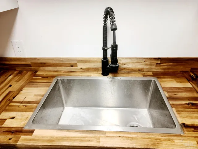 a view of a kitchen with a sink and a stove