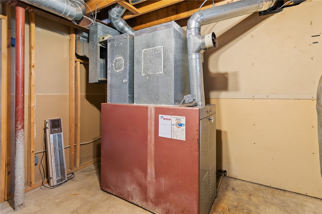 4397 Sebring Road Sodus, NY 14551 - Photo 33 of 43 The furnace - there’s also a woodburner to keep th
