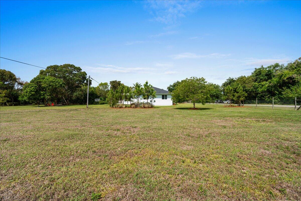 19724 Southwest 243rd Terrace Homestead, FL 33031 - Photo 36 of 49 a view of a green field with wooden fence
