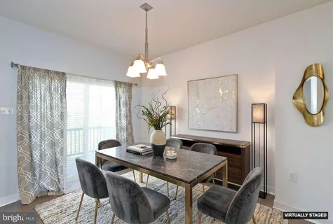 a view of a livingroom with a chandelier fan