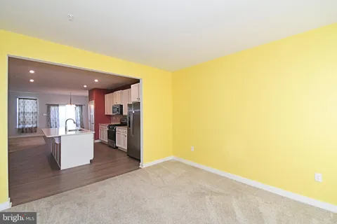 a view of a living room and kitchen