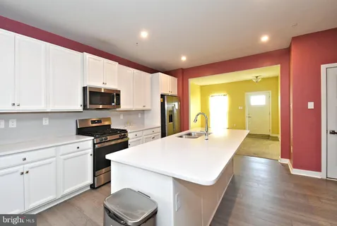 a kitchen with a stove and a sink