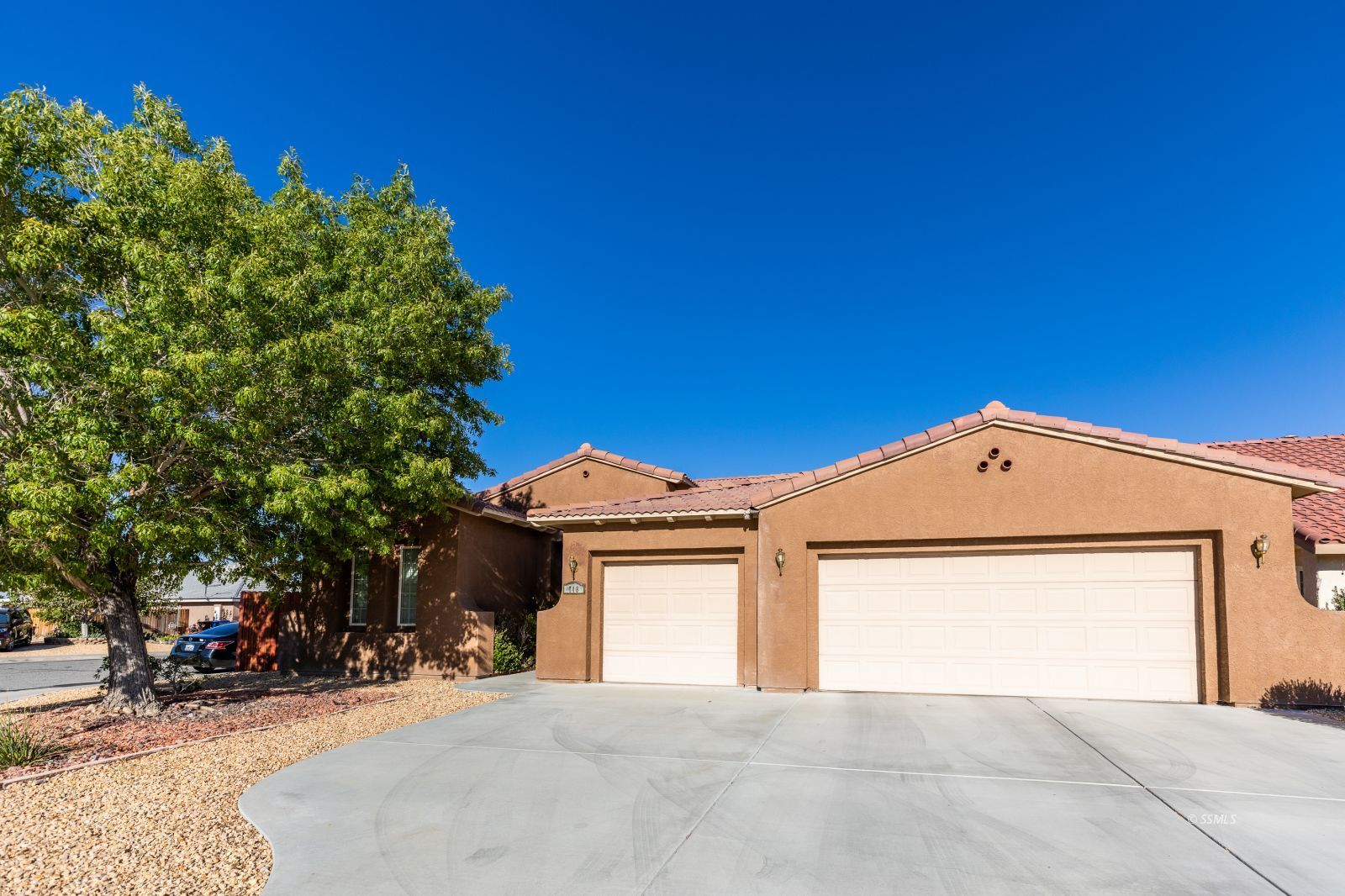 718 Pinon Court Ridgecrest, CA 93555 - Photo 1 of 41 a view of a house with a yard and garage