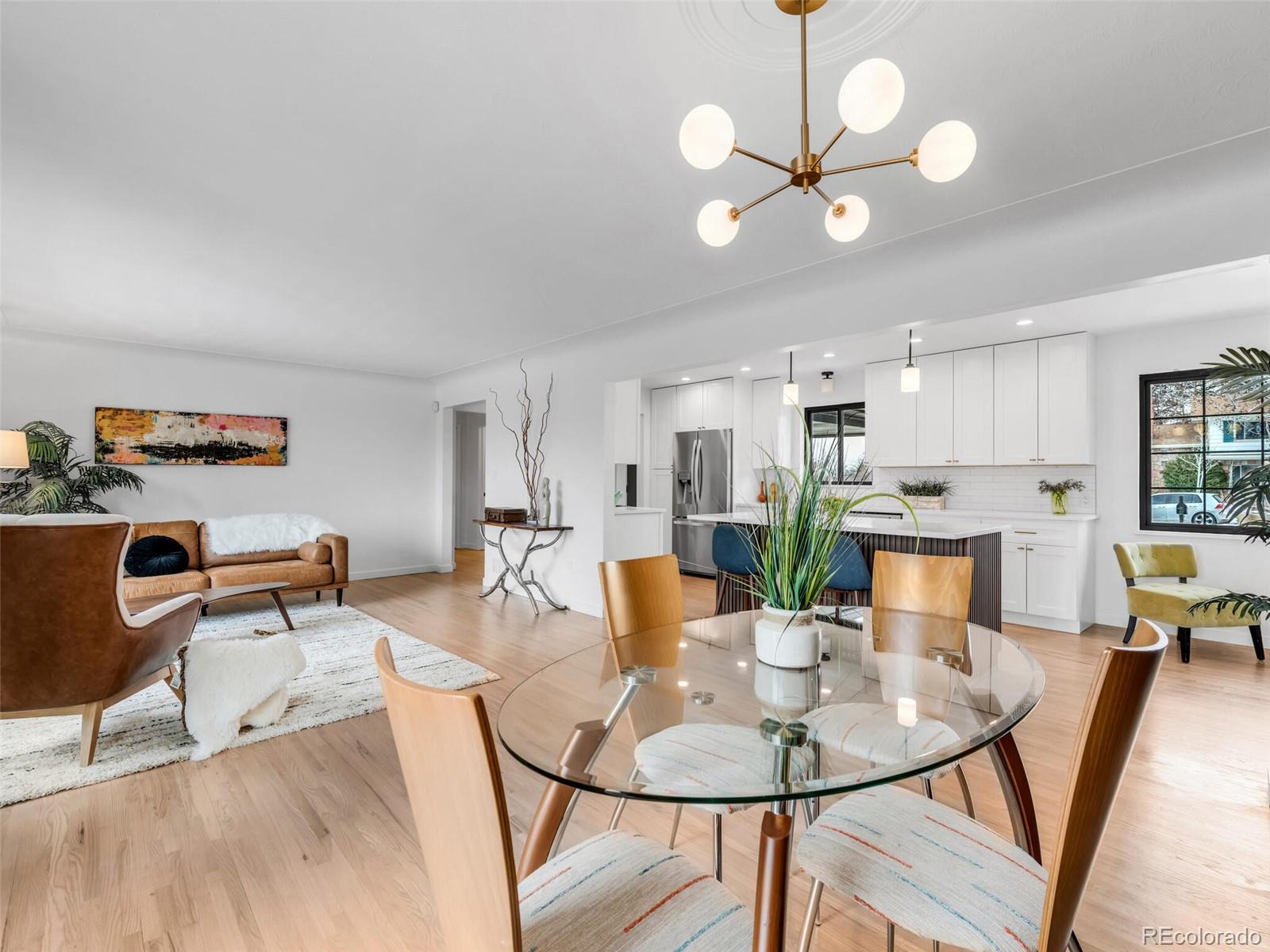 1345 Overhill Road Golden, CO 80401 - Photo 11 of 40 a view of a dining room with furniture and wooden floor