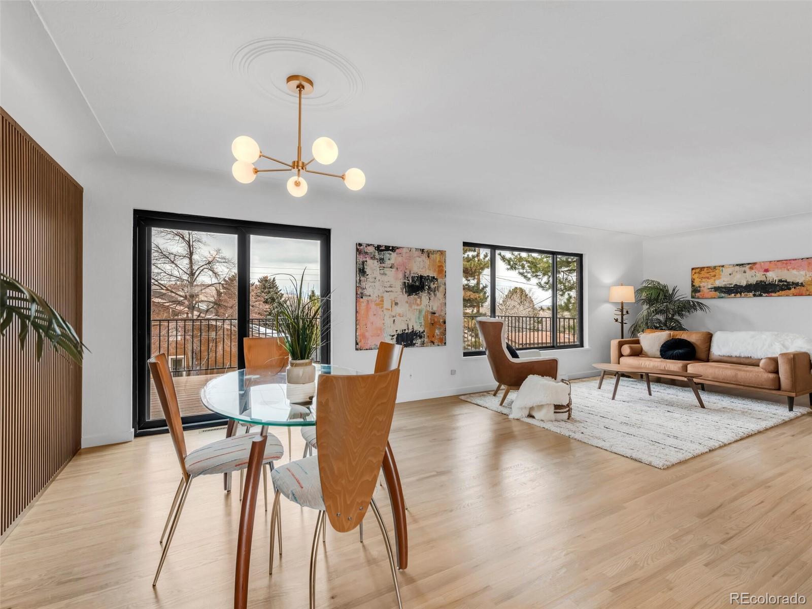 1345 Overhill Road Golden, CO 80401 - Photo 12 of 40 a view of a dining room with furniture wooden floor and a chandelier