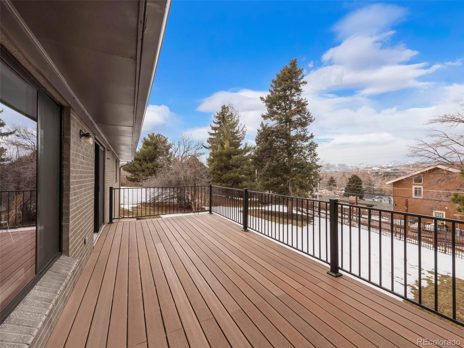 1345 Overhill Road Golden, CO 80401 - Photo 17 of 40 a view of balcony with wooden floor and fence