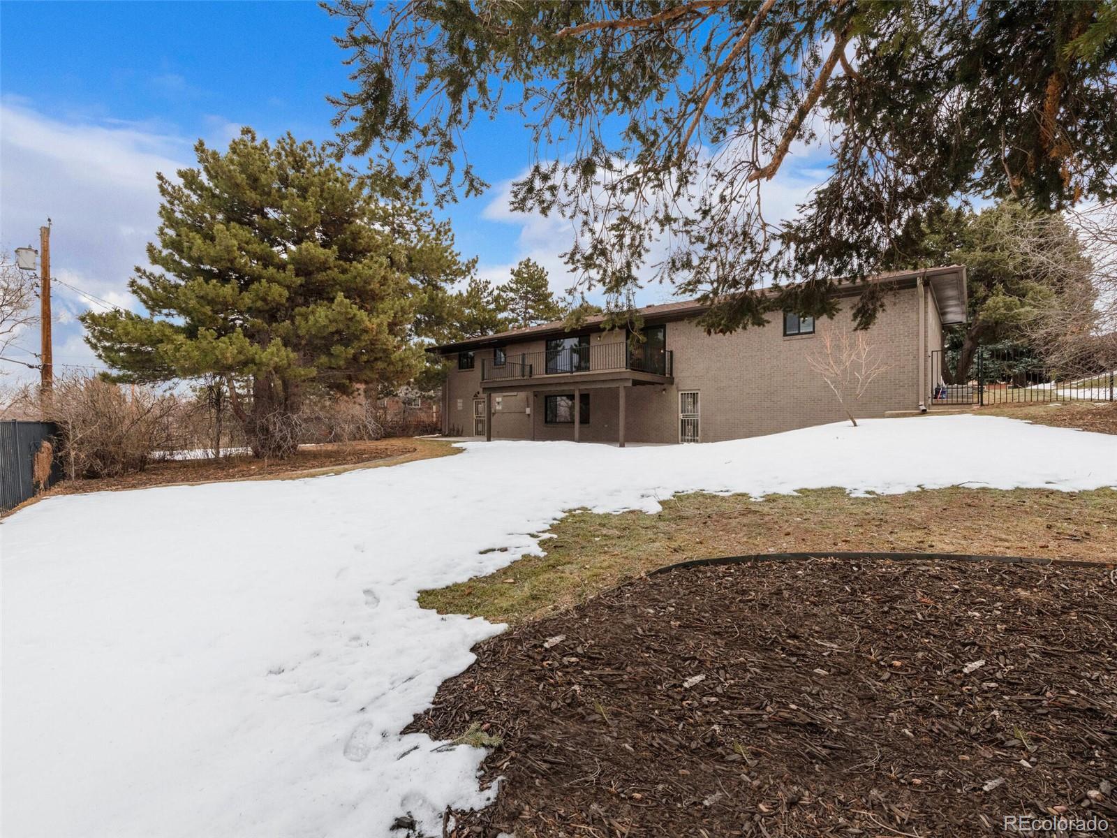 1345 Overhill Road Golden, CO 80401 - Photo 19 of 40 a view of a house with a snow in yard