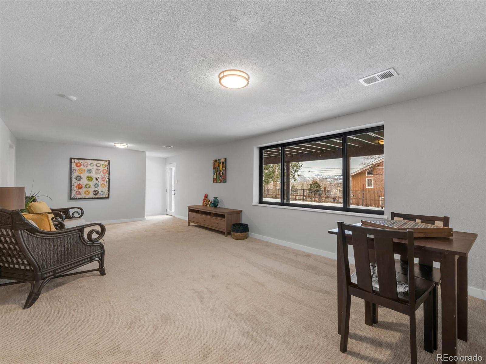 1345 Overhill Road Golden, CO 80401 - Photo 21 of 40 a living room with furniture and a window
