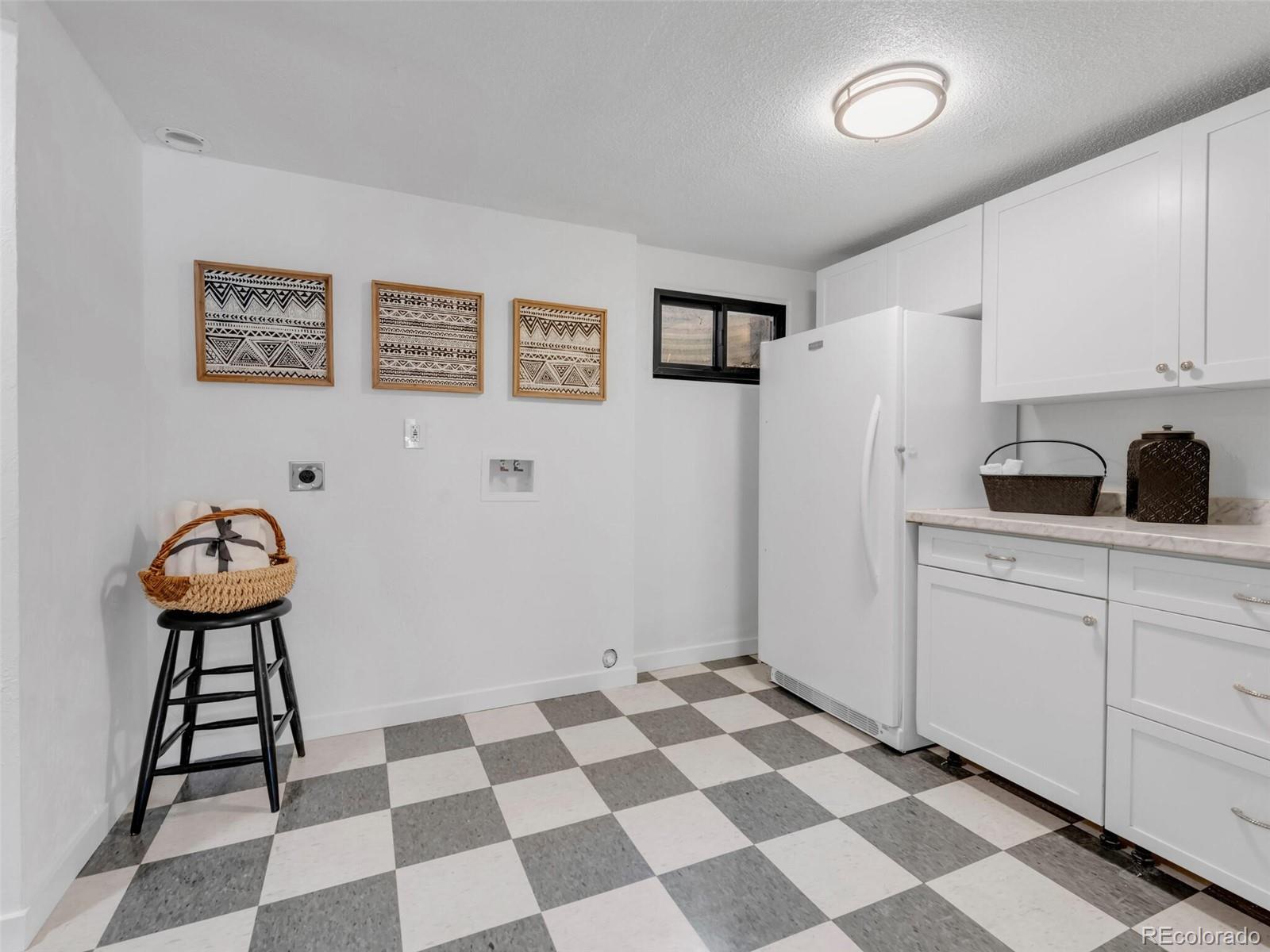 1345 Overhill Road Golden, CO 80401 - Photo 26 of 40 a kitchen with a checkered floor and a sink