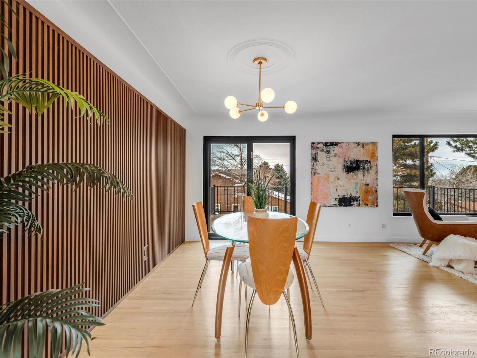 1345 Overhill Road Golden, CO 80401 - Photo 30 of 40 a view of a dining room with furniture wooden floor and a chandelier