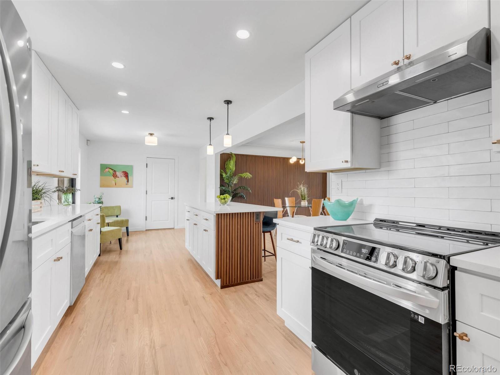 1345 Overhill Road Golden, CO 80401 - Photo 4 of 40 a kitchen with a stove a sink and a refrigerator