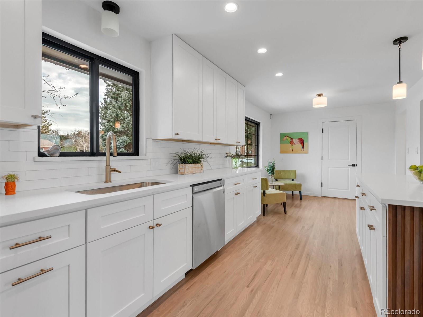 1345 Overhill Road Golden, CO 80401 - Photo 5 of 40 a kitchen with sink cabinets and wooden floor