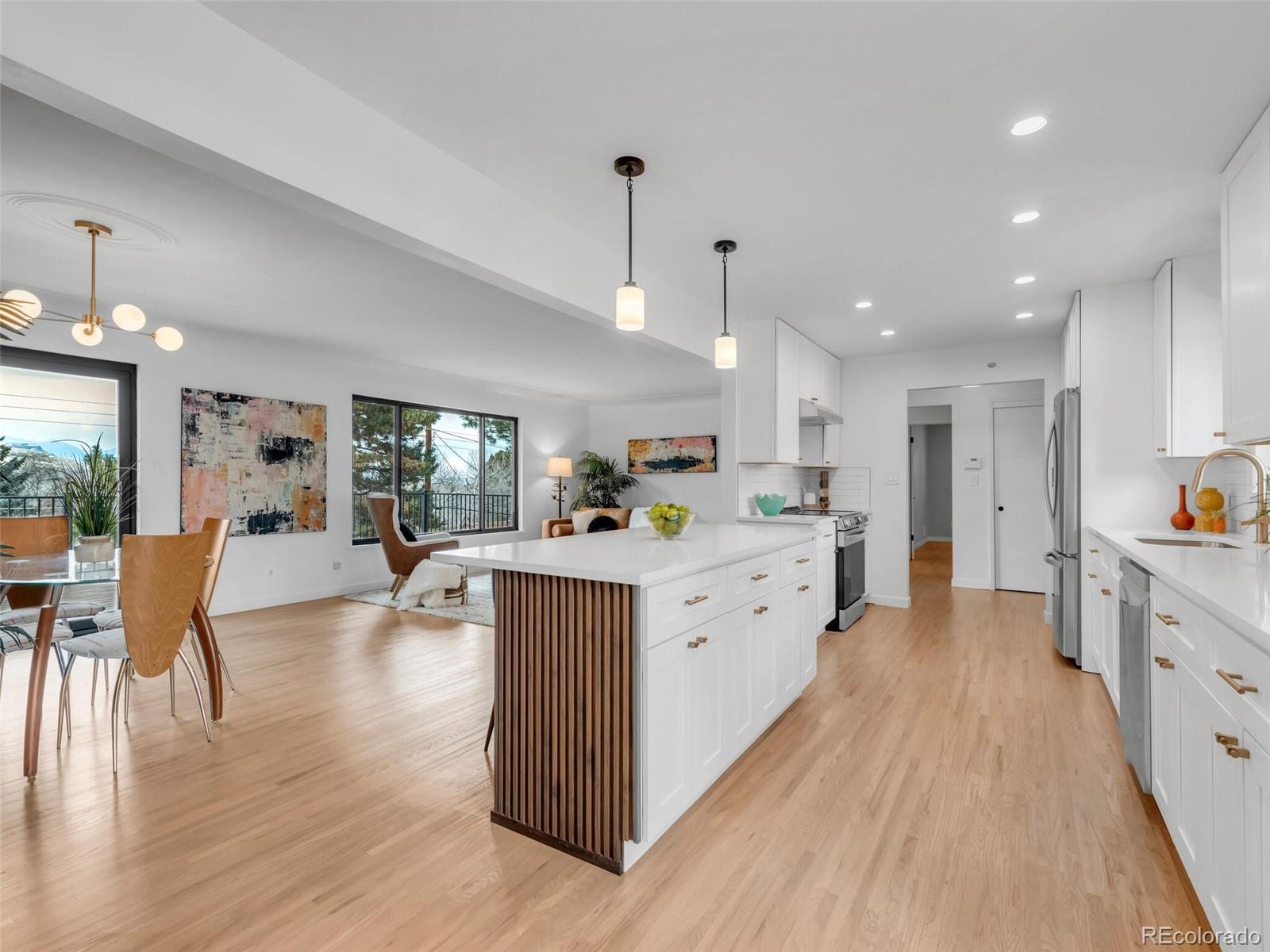 1345 Overhill Road Golden, CO 80401 - Photo 6 of 40 a large white kitchen with lots of counter space
