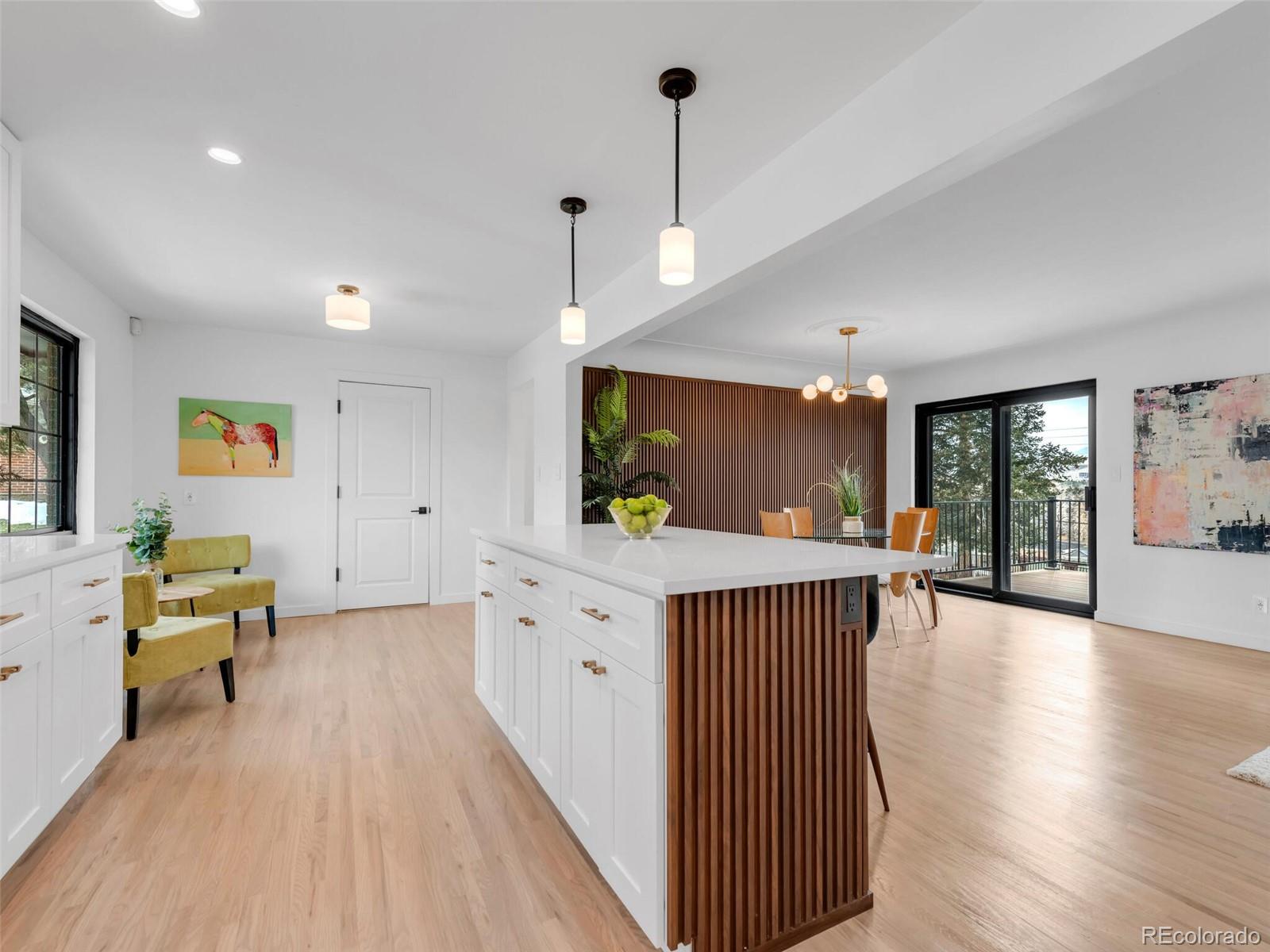 1345 Overhill Road Golden, CO 80401 - Photo 7 of 40 a open kitchen with stainless steel appliances granite countertop a refrigerator a sink dishwasher a dining table and chairs with wooden floor