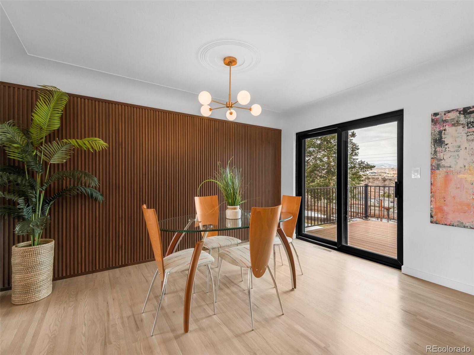 1345 Overhill Road Golden, CO 80401 - Photo 8 of 40 a dining room with furniture and wooden floor