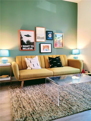 a living room with furniture and a rug