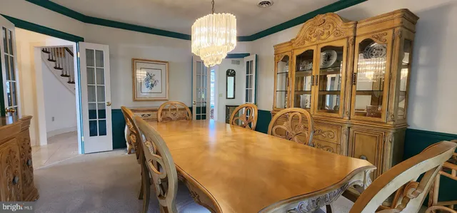 a view of a room with wooden floor and door