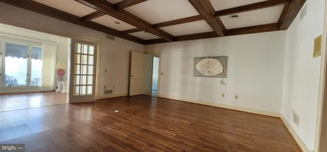 a view of room with stairs and a floor to ceiling window