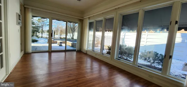 a view of entryway and hall with a door