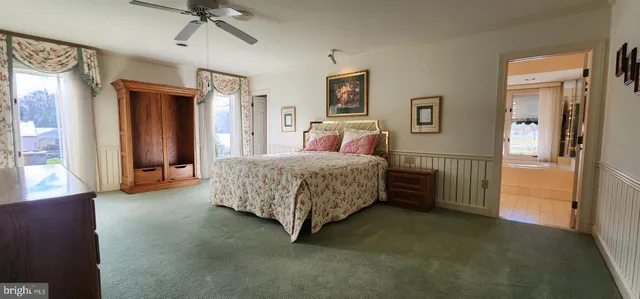 an empty room with a fireplace cabinet and window