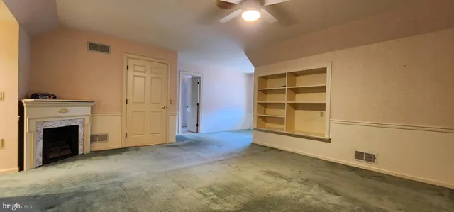 a kitchen with stainless steel appliances granite countertop a refrigerator and a stove