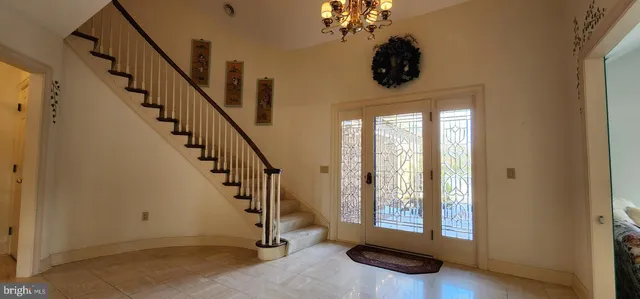 a view of an entryway with wooden floor and windows