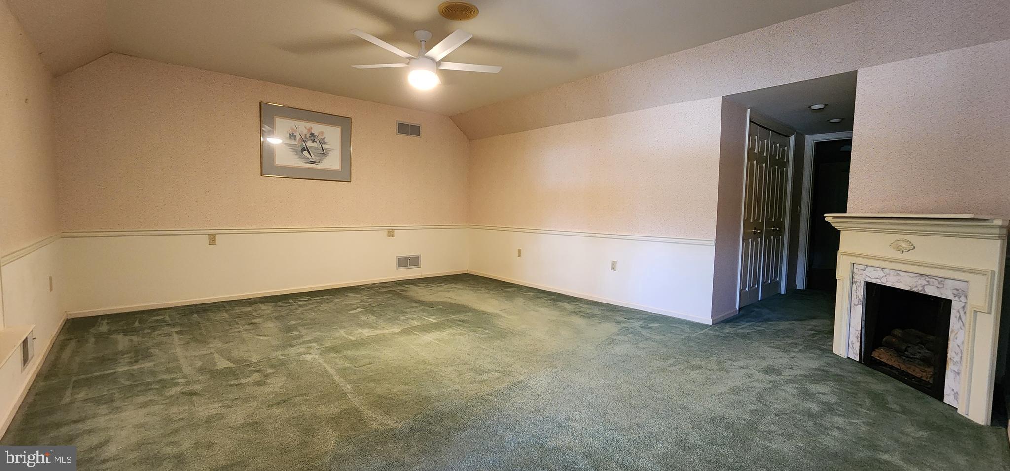 4069 West Tilden Road Harrisburg, PA 17110 - Photo 33 of 56 en empty room with windows and fireplace