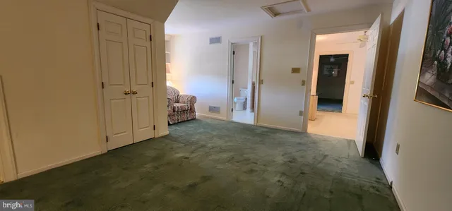 a view of a patio with table and chairs with wooden floor and fence
