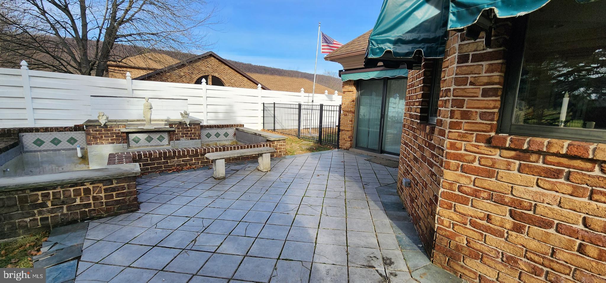 4069 West Tilden Road Harrisburg, PA 17110 - Photo 52 of 56 a view of a patio with table and chairs with wooden floor and fence