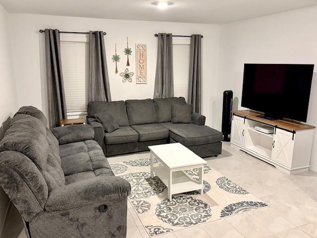 464 Reverie Way Ferris, TX 75125 - Photo 5 of 21 a living room with furniture and a flat screen tv