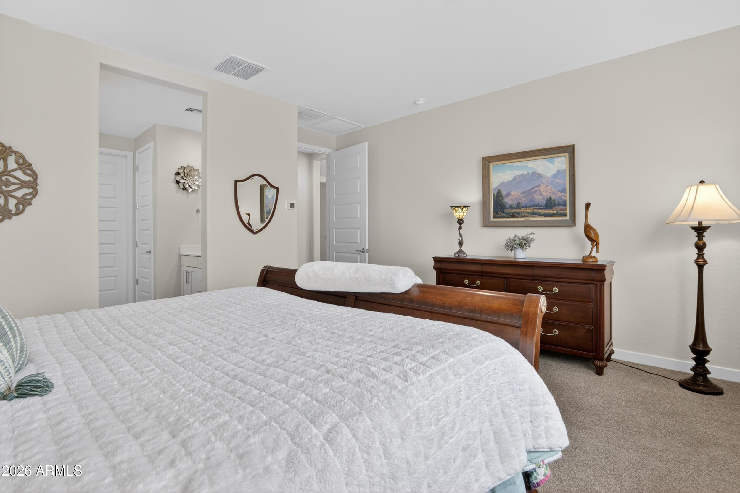 12330 East Soloman Road Gold Canyon, AZ 85118 - Photo 25 of 69 a bedroom with a bed and a chandelier