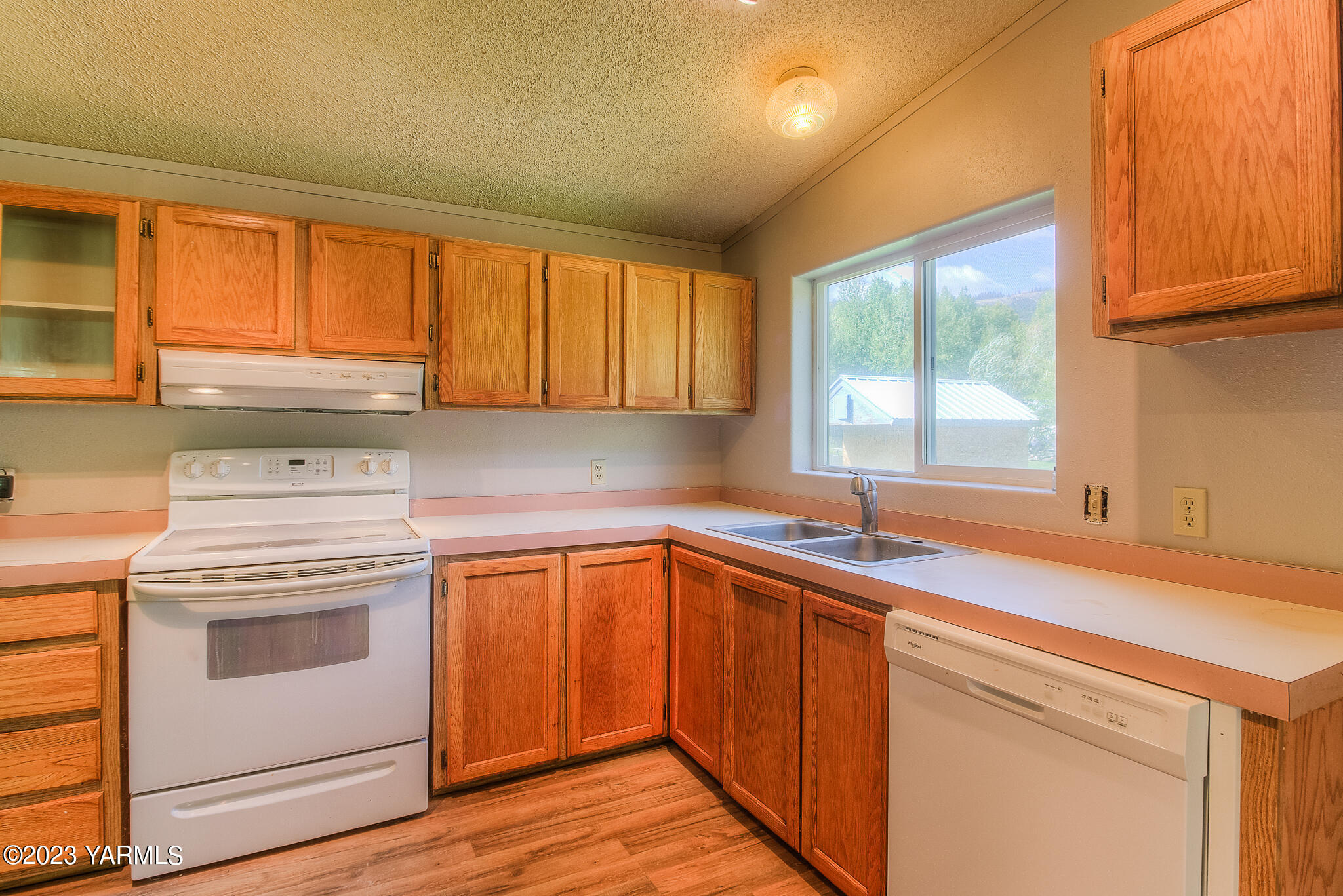1710 North Fork Road Yakima, WA 98903 - Photo 12 of 34 a kitchen with a sink stove and cabinets