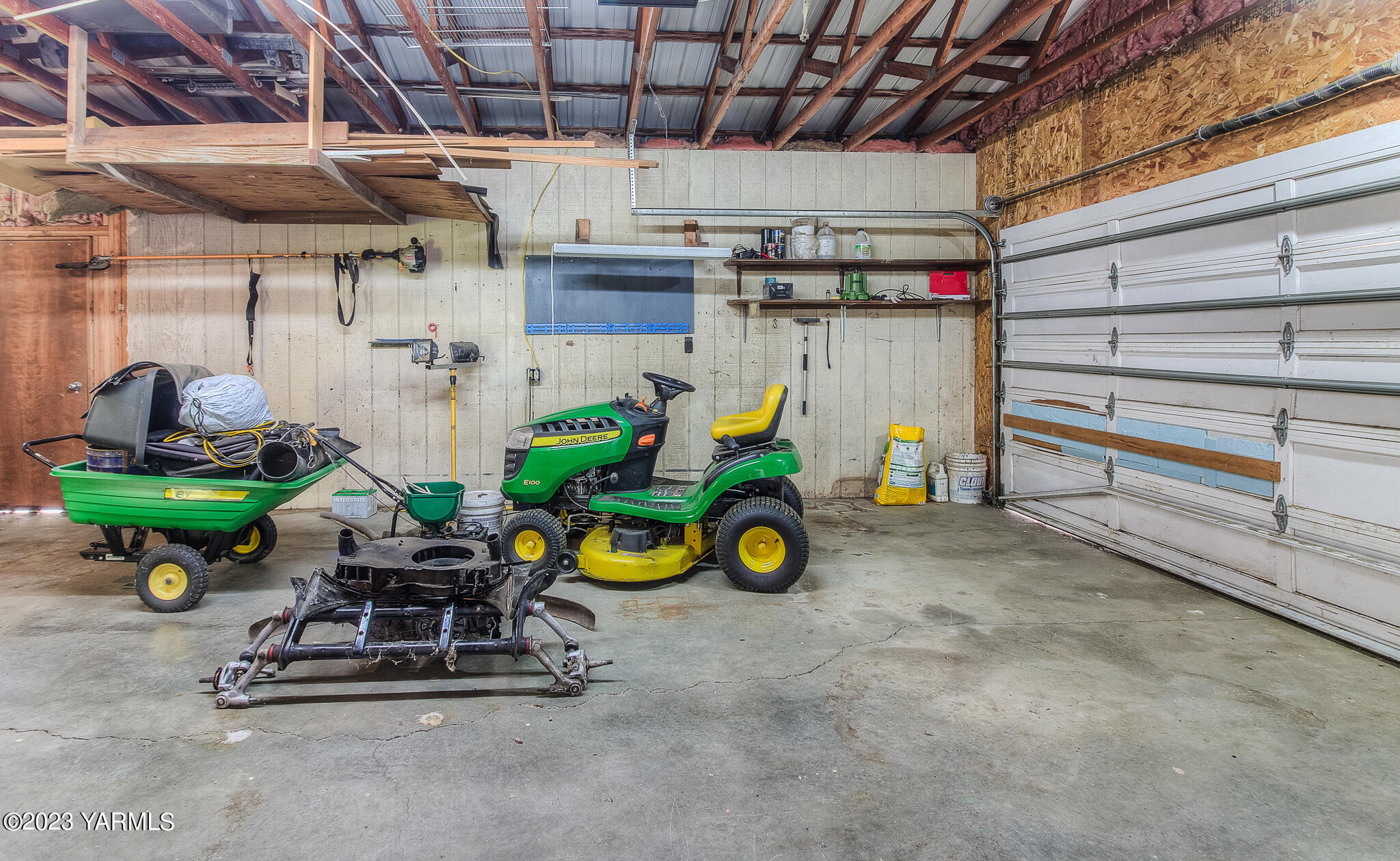 1710 North Fork Road Yakima, WA 98903 - Photo 27 of 34 a view of a garage with a wooden table and a chairs