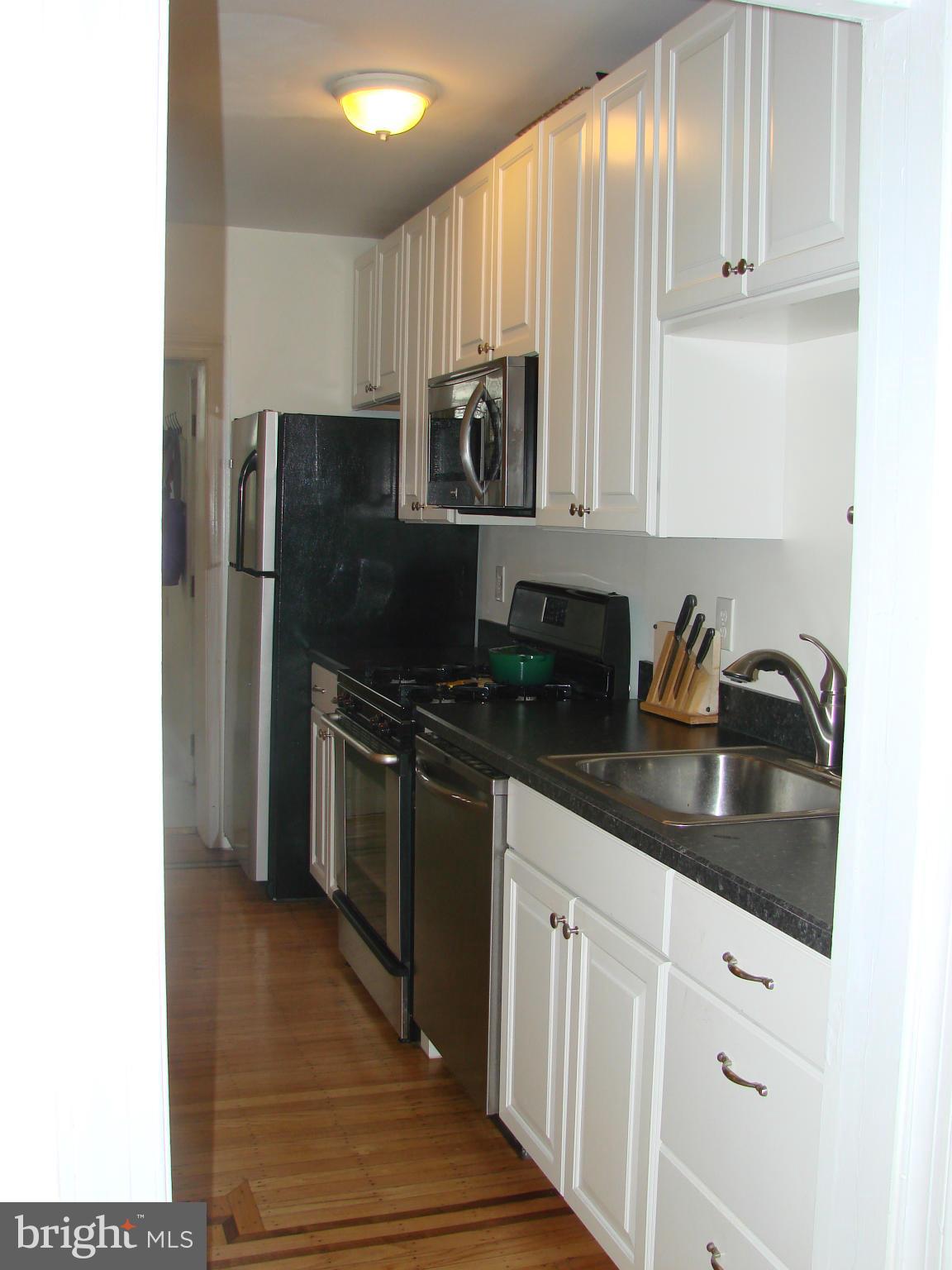 3633 Yolando Road Baltimore, MD 21218 - Photo 11 of 24 a kitchen with stainless steel appliances granite countertop a refrigerator and a stove top oven