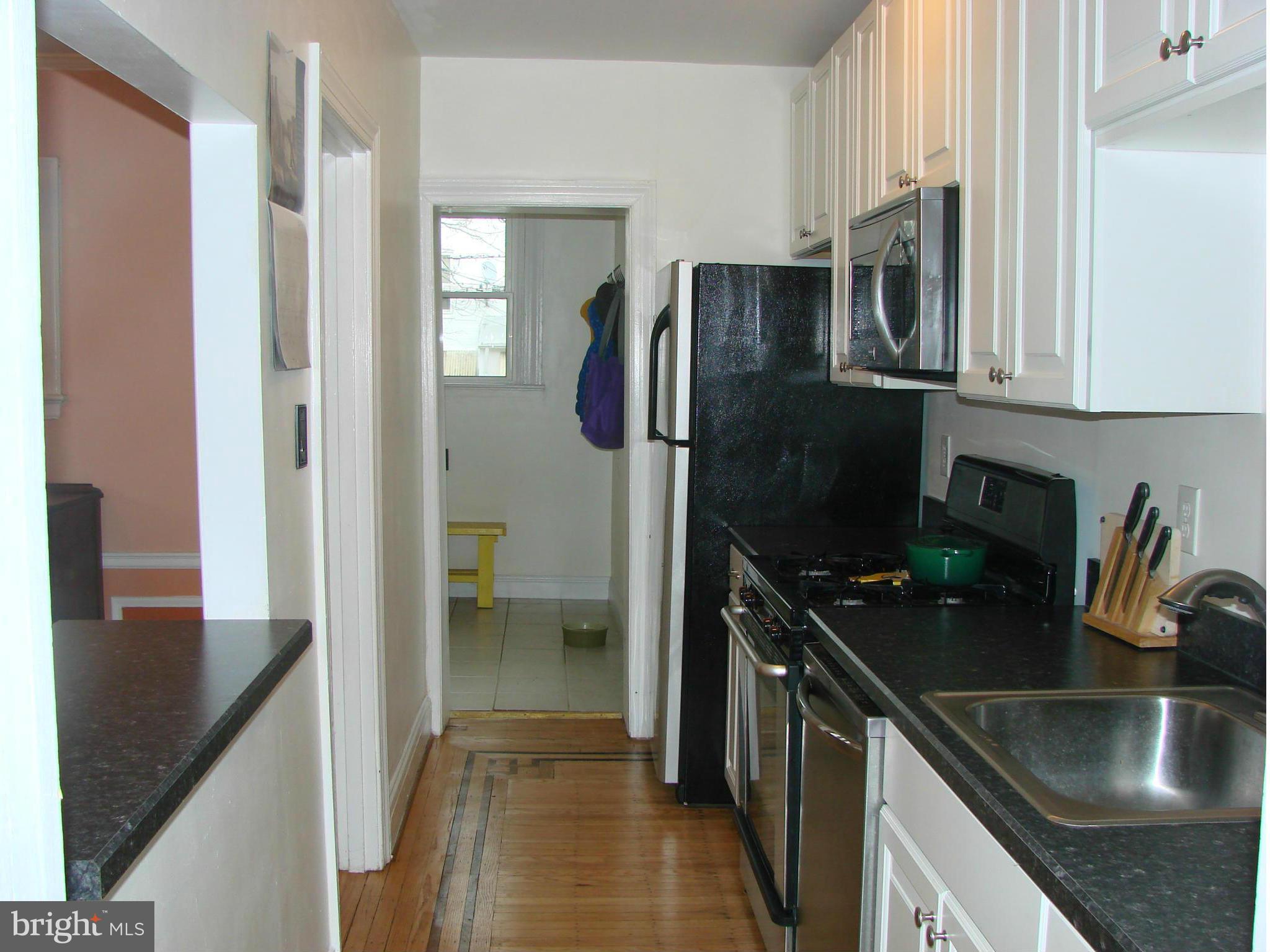 3633 Yolando Road Baltimore, MD 21218 - Photo 12 of 24 a kitchen with stainless steel appliances granite countertop a refrigerator a stove and a sink