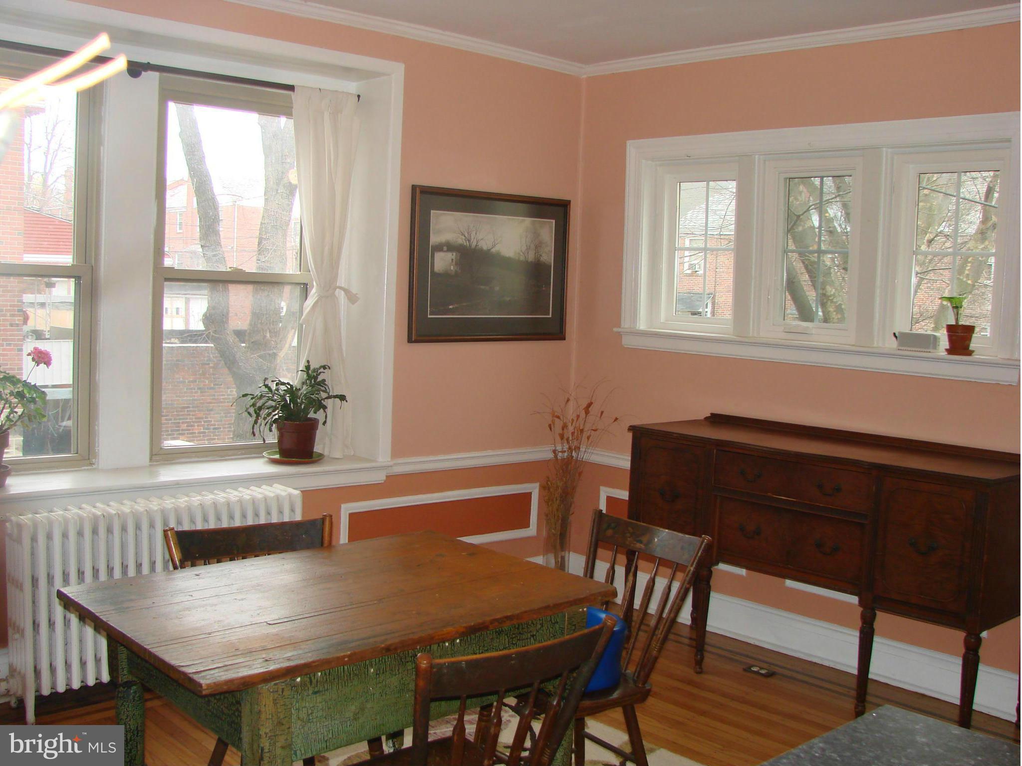 3633 Yolando Road Baltimore, MD 21218 - Photo 13 of 24 a view of a dining room with furniture window and wooden floor