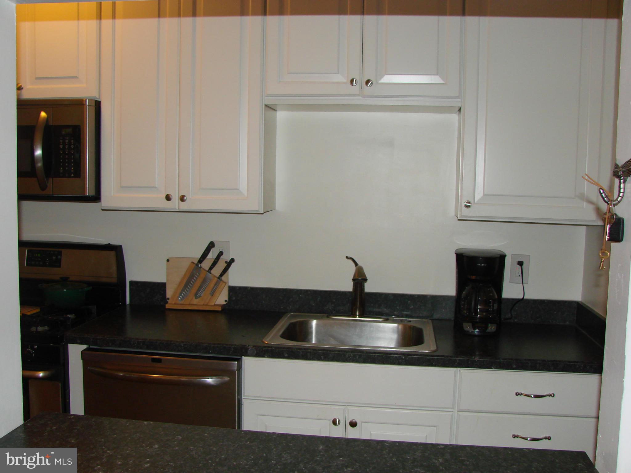 3633 Yolando Road Baltimore, MD 21218 - Photo 14 of 24 a kitchen with a sink and cabinets