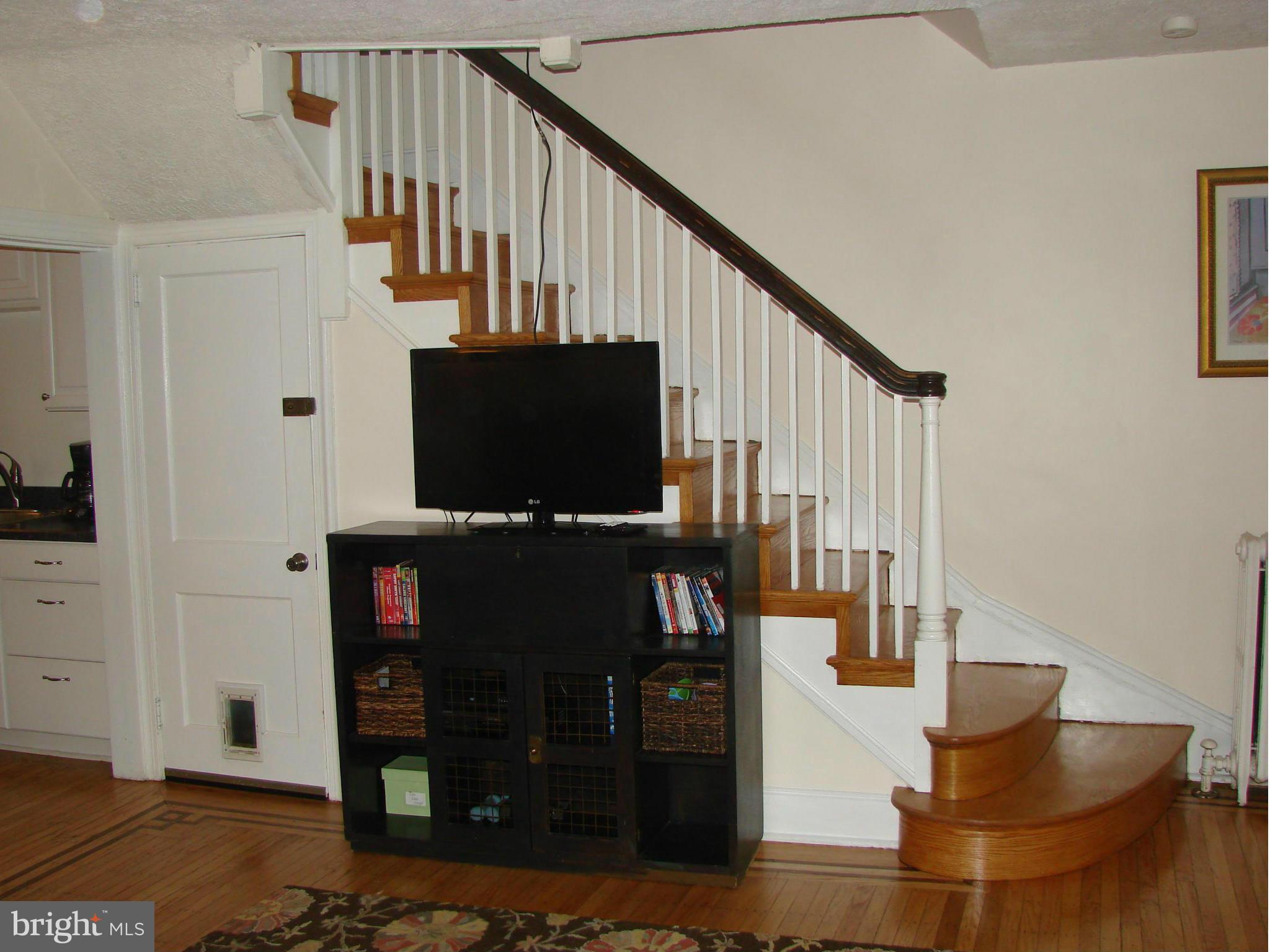 3633 Yolando Road Baltimore, MD 21218 - Photo 15 of 24 a living room with wooden floor and a flat screen tv
