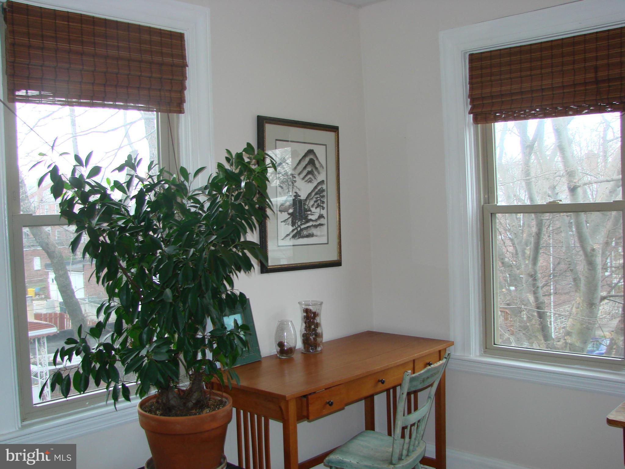 3633 Yolando Road Baltimore, MD 21218 - Photo 19 of 24 a workspace with furniture and a potted plant