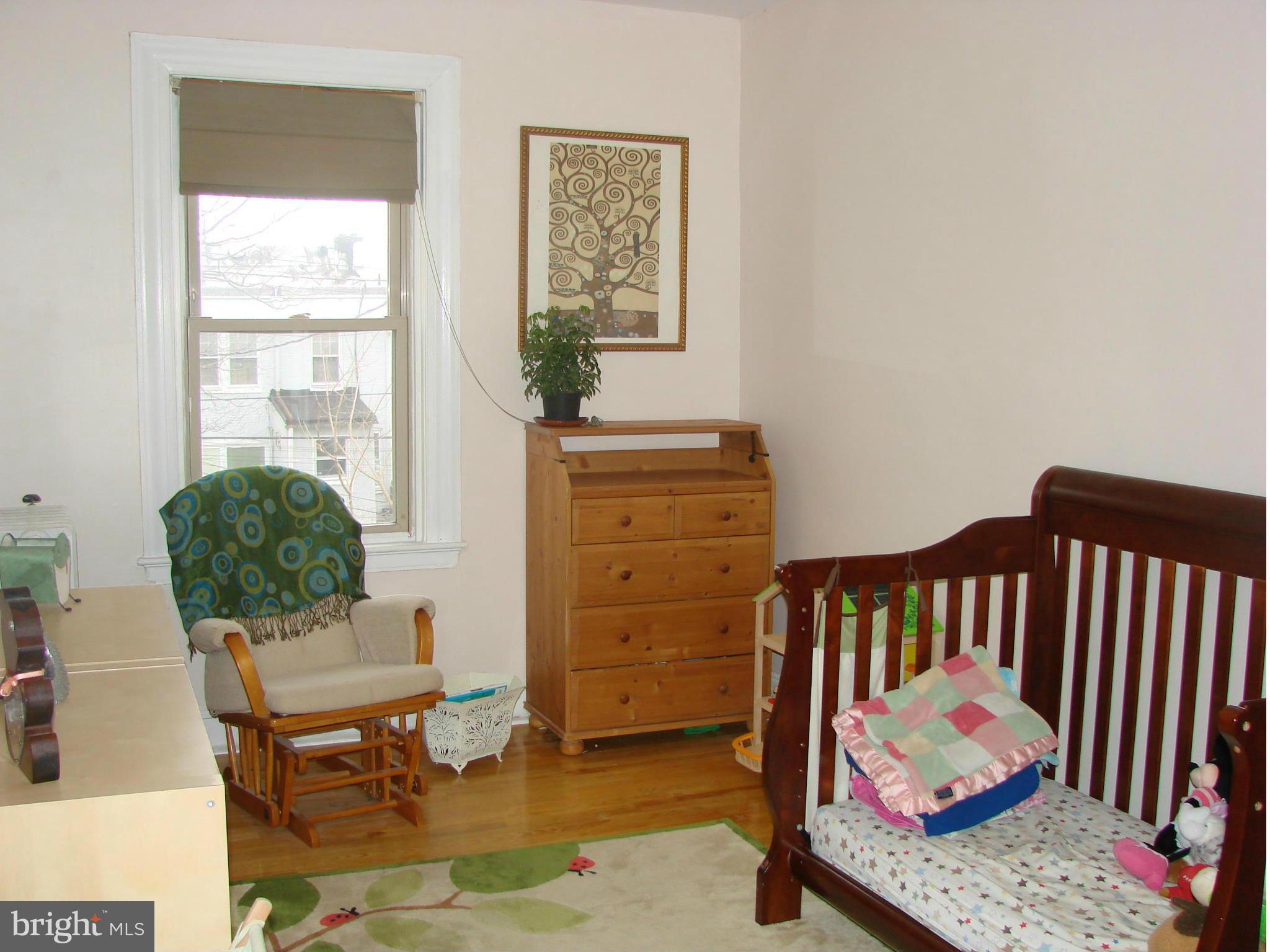 3633 Yolando Road Baltimore, MD 21218 - Photo 21 of 24 a bedroom with furniture and a window