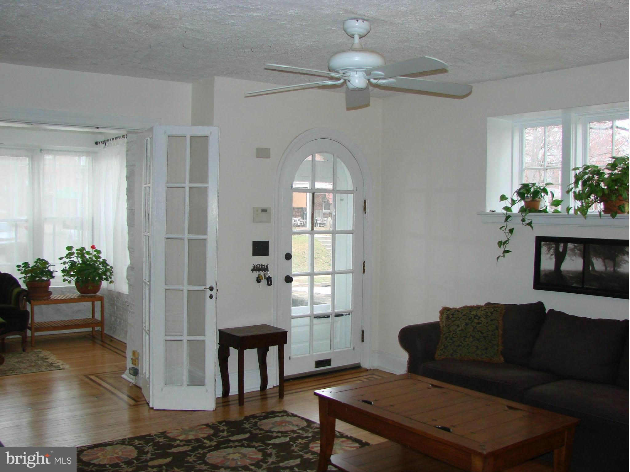 3633 Yolando Road Baltimore, MD 21218 - Photo 5 of 24 a living room with furniture and a chandelier