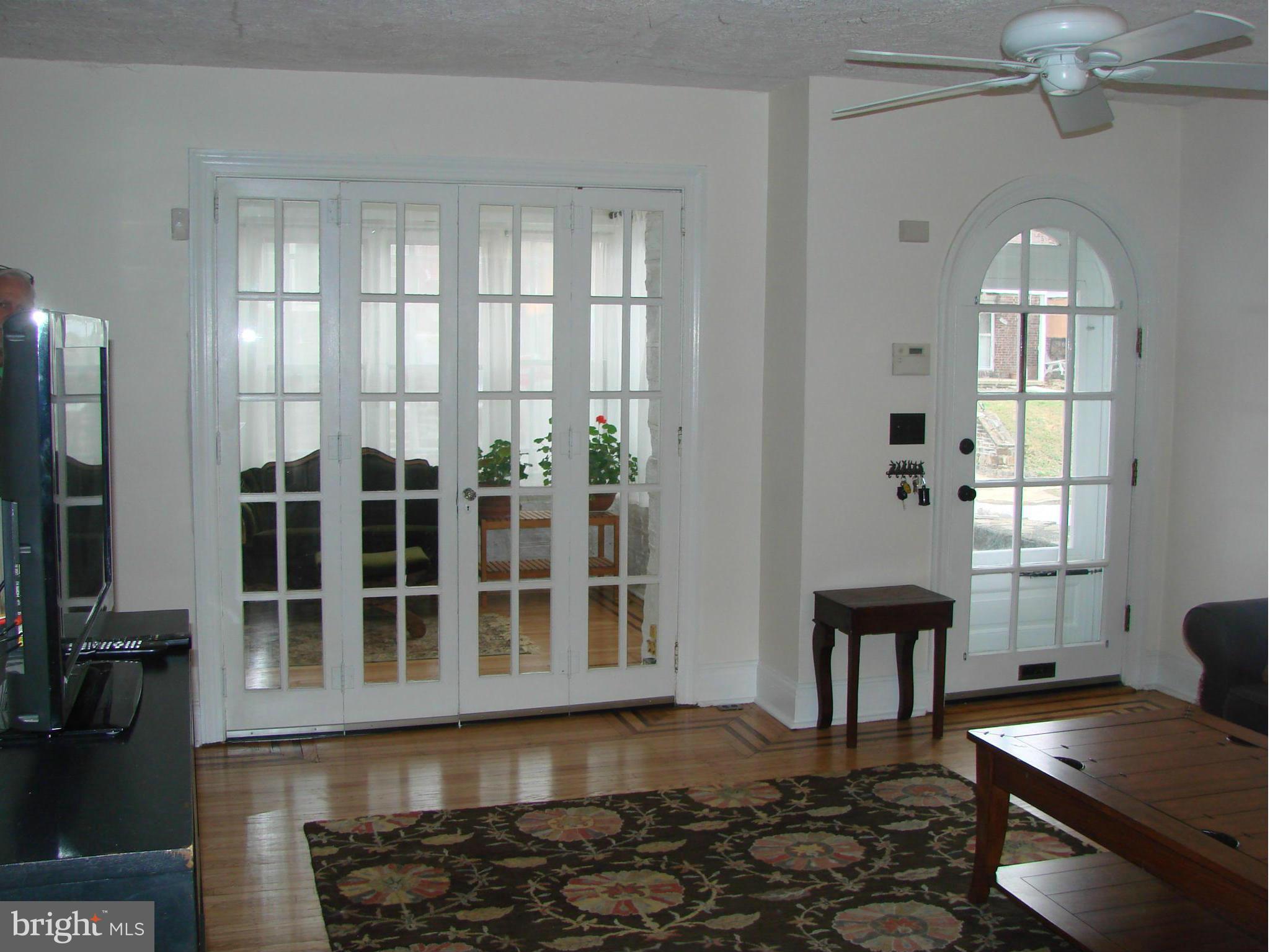 3633 Yolando Road Baltimore, MD 21218 - Photo 6 of 24 a view of a livingroom with furniture window and wooden floor